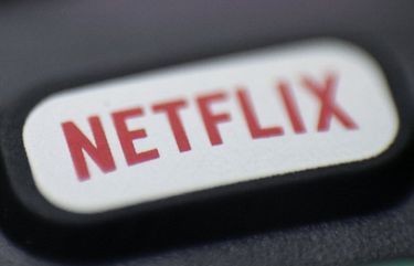 FILE – This Aug. 13, 2020  photo shows a logo for Netflix on a remote control in Portland, Ore. Netflix Inc. (NFLX) on Tuesday, Oct. 20, 2020 reported third-quarter net income of $790 million. The Los Gatos, California-based company said it had profit of $1.74 per share. (AP Photo/Jenny Kane, File) NYBZ901 NYBZ901
