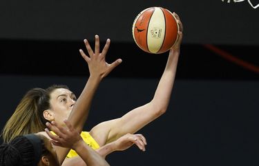 Seattle Storm forward Breanna Stewart (30) shoots over Las Vegas Aces guard Jackie Young and center A’ja Wilson during the second half of Game 1 of basketball’s WNBA Finals Friday, Oct. 2, 2020, in Bradenton, Fla. (AP Photo/Chris O’Meara) FLCO119 FLCO119