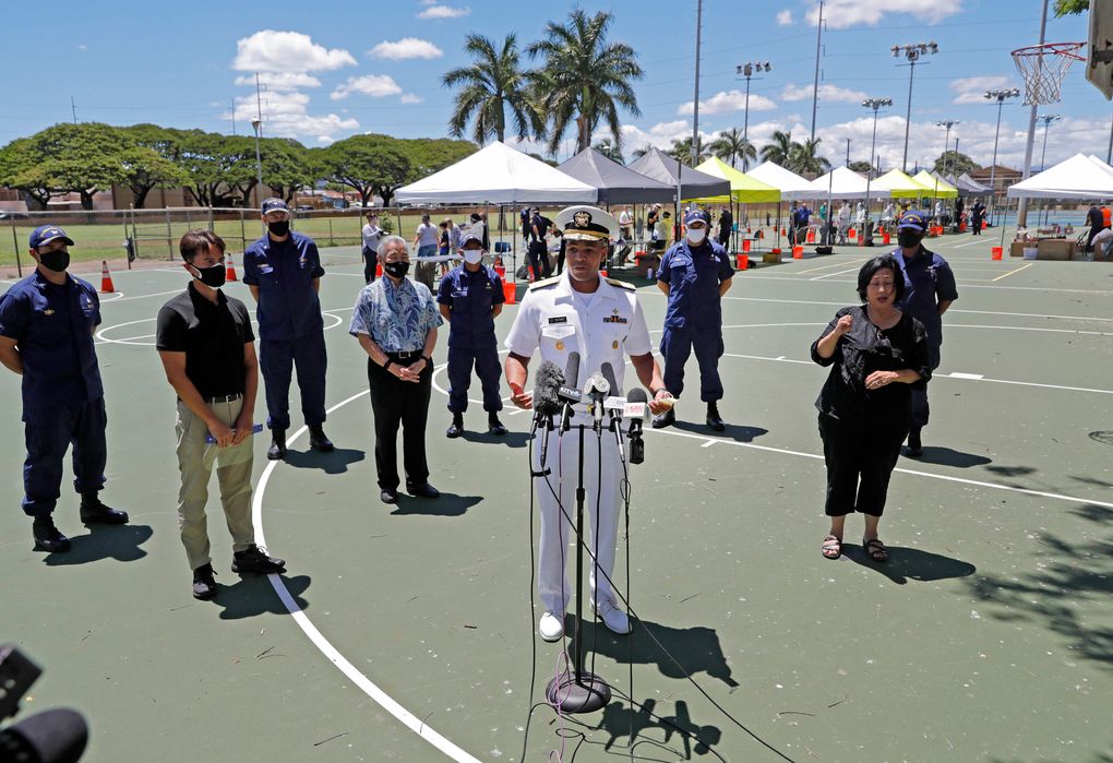 FILE – In this Aug. 27, 2020 file photo U.S. Surgeon General Vice Adm. Jerome Adams speaks during a press conference on the second day of surge COVID-19 testing, at Kalakaua District Park in Honolulu. Adams who was cited for being in a closed Hawaii park in August while in the islands helping with surge testing amid a spike in coronavirus cases, appears for a virtual arraignment in a Hawaii court on Wednesday, Oct. 21, 2020. (Jamm Aquino/Honolulu Star-Advertiser via AP,File)