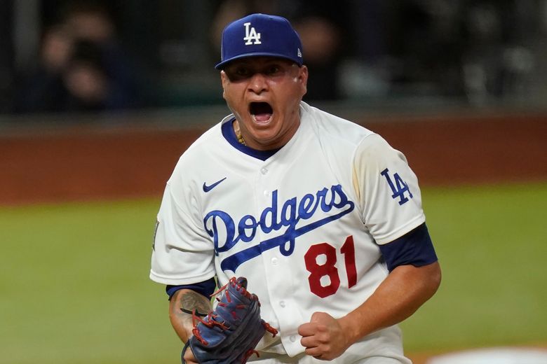 Los Angeles Dodgers pitcher Julio Urias celebrates the end of the