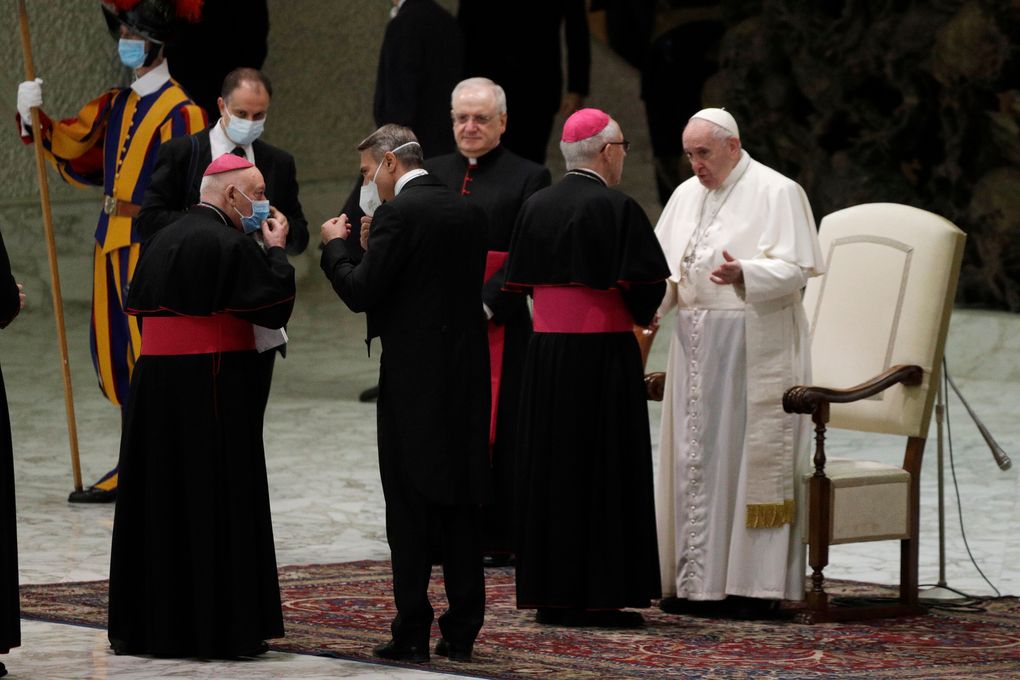 Pope Francis meets with bishops in the Paul VI hall on the occasion of the weekly general audience at the Vatican, Wednesday, Oct. 21, 2020. His decision to eschew masks is drawing criticism. (AP Photo/Gregorio Borgia)