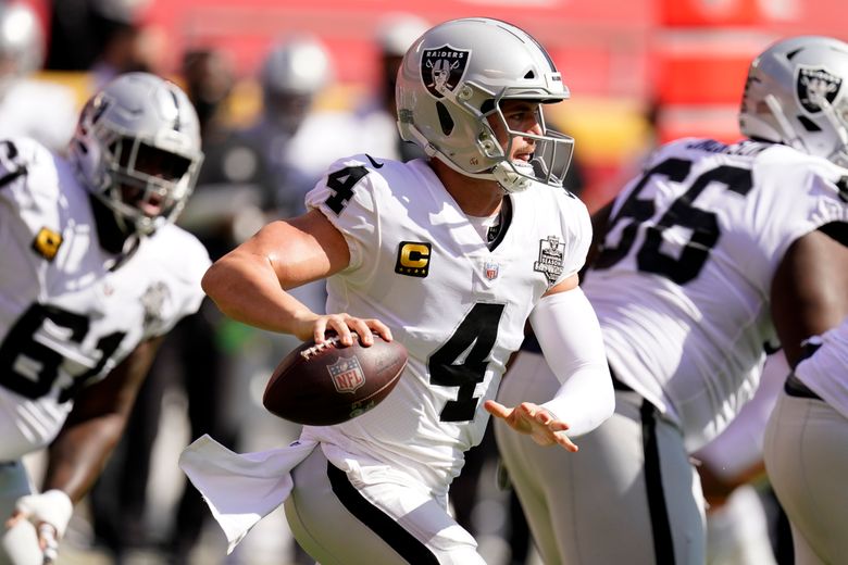 Oakland Raiders quarterback Daryle Lamonica looks to throw