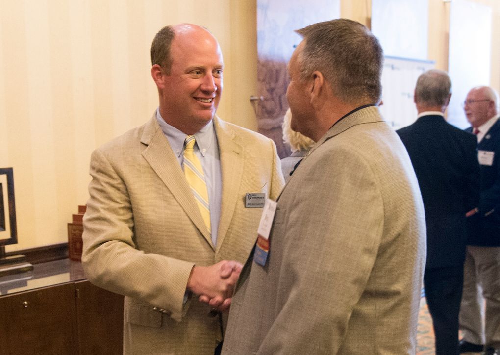 FILE – In this Sept. 11, 2018, file photo, Will Ainsworth, center, then-Republican nominee for lieutenant governor, talks with constituents during the Public Retiree Convention at Renaissance Hotel in Montgomery, Ala. Lt. Gov. Ainsworth, who has called the state mask order a government overstep, announced Wednesday, Oct. 21, 2020, that he tested positive for the new coronavirus. (Jake Crandall/The Montgomery Advertiser via AP, File)