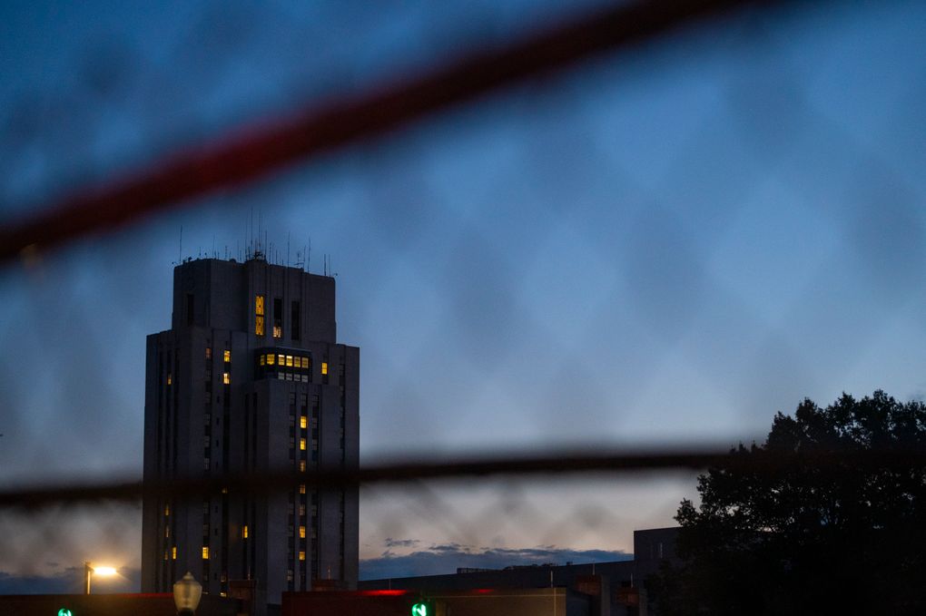 Walter Reed National Military Medical Center is seen through a fence in Bethesda, Md., Monday, Oct. 5, 2020. (AP Photo/Cliff Owen)