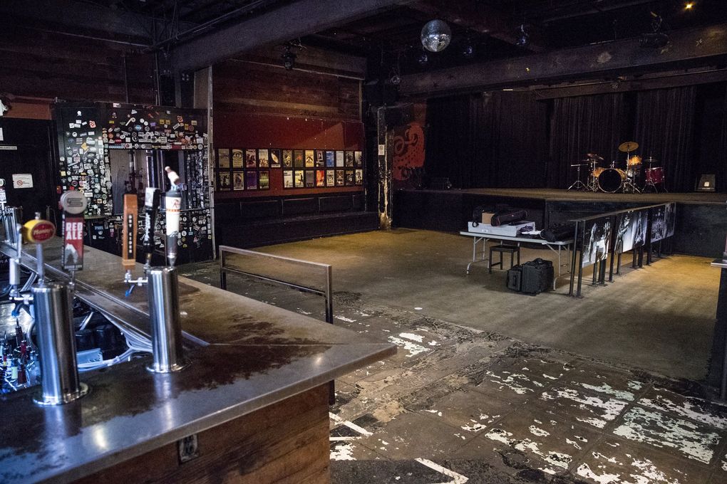 The main room at the Crocodile has seen many shows. “On the flip side, though, this building in and of itself doesn’t encapsulate the Crocodile,” says co-owner Marcus Charles. “The people … the history, the bands who come through — all those things are what really made the Crocodile.” (Amanda Snyder / The Seattle Times)