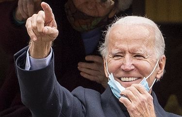Democratic presidential candidate, former Vice President Joe Biden, gestures and smiles from the front steps of his childhood home, during a visit on Election Day, Tuesday, Nov. 3, 2020, in Scranton, Pa. (Jose F. Moreno/The Philadelphia Inquirer via AP) PAPHQ605 PAPHQ605