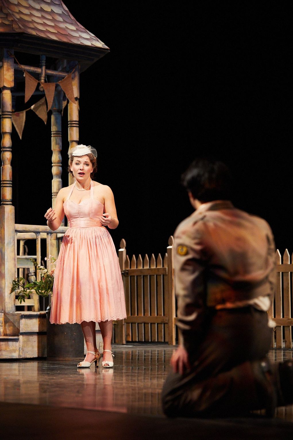 Madison Leonard (who portrays Adina) and Andrew Stenson (Nemorino) perform with socially distanced staging for Seattle Opera’s “The Elixir of Love.” (Philip Newton)