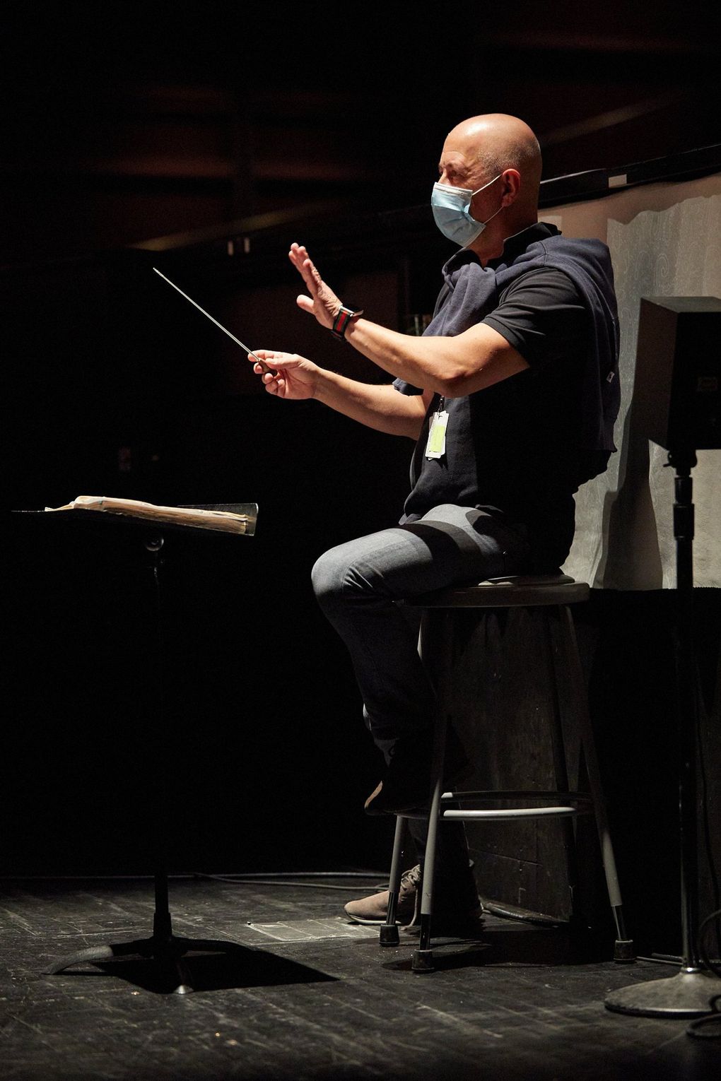 Maestro Carlo Montanaro in the orchestra pit for the filming of Seattle Opera’s “The Elixir of Love.” (Philip Newton)