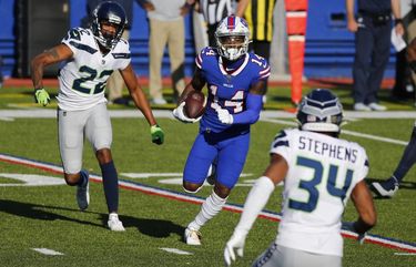 Buffalo Bills’ Stefon Diggs (14) runs away from Seattle Seahawks’ Quinton Dunbar (22) and Linden Stephens (34) during the first half of an NFL football game Sunday, Nov. 8, 2020, in Orchard Park, N.Y. (AP Photo/Jeffrey T. Barnes) NYFF1 NYFF1