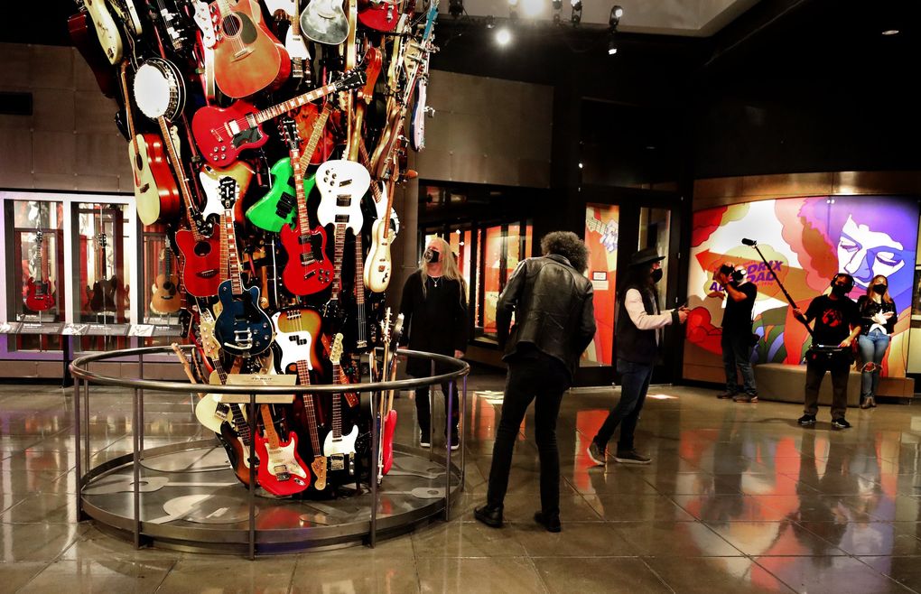 Alice in Chains members check out artist Trimpin’s two-story tower of guitars at MoPOP during a break in their recording of a video for the Founders Award ceremony, scheduled to be streamed Dec. 1. (Alan Berner / The Seattle Times)