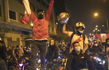A caravan of demonstrators on motorcycles ride as they wait for news on who will be the country’s next president, in Lima, Peru, Sunday, Nov. 15, 2020. Manuel Merino announced his resignation following massive protests, unleashed when lawmakers ousted President Martin Vizcarra. (AP Photo/Rodrigo Abd) ABD109 ABD109