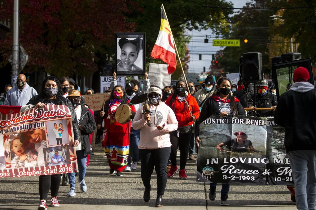 Rose Davis, center, participates in a march for her sister Renee Davis, a pregnant mother of three and member of the Muckleshoot Indian Tribe who was killed along with her unborn child in October 2016. Two King County sheriff’s deputies fatally shot Davis in her own bed during a welfare check in her home on the Muckleshoot reservation. (Bettina Hansen / The Seattle Times)