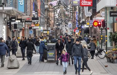 People walk along the Drottninggatan shopping street in central Stockholm, Sweden, Tuesday Nov. 10, 2020. (Fredrik Sandberg/TT via AP) LBJ805 LBJ805