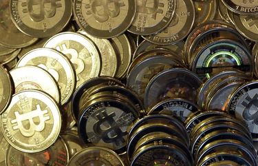FILE – This April 3, 2013, file photo shows bitcoin tokens in Sandy, Utah. Unidentified hackers broke into the Twitter accounts of technology moguls, politicians, celebrities and major companies Wednesday, July 15, 2020, in an apparent Bitcoin scam. (AP Photo/Rick Bowmer, File) NYSB354