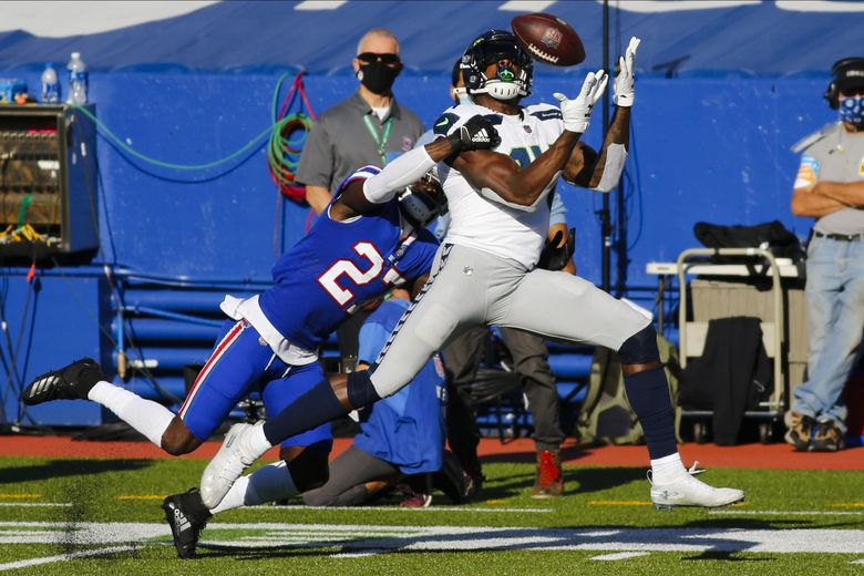 Seattle Seahawks wide receiver DK Metcalf (14) runs a pass route against  the Buffalo Bills during the first half of an NFL football game, Sunday,  Nov. 8, 2020, in Orchard Park, N.Y. (