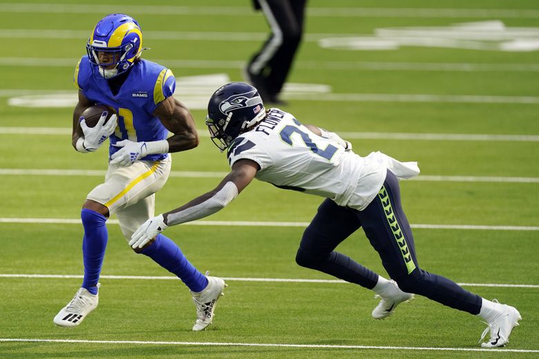 Tre Flowers of the Seattle Seahawks runs off of the field after the