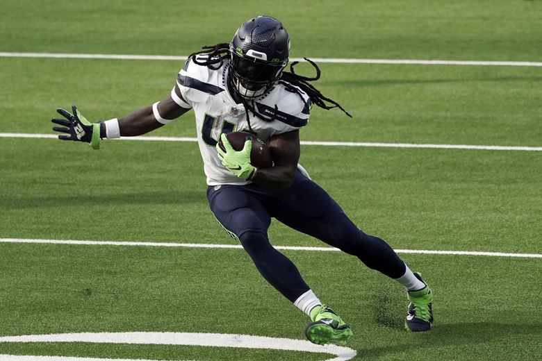 Seattle Seahawks running back Rashaad Penny (20) runs from Arizona  Cardinals inside linebacker Zaven Collins (25) during an NFL Professional  Football Game Sunday, Jan. 9, 2022, in Phoenix. (AP Photo/John McCoy Stock  Photo - Alamy