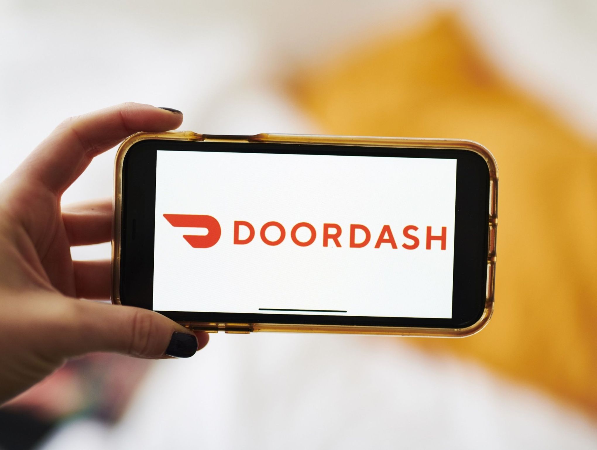 DoorDash projects strong demand for food, grocery orders; shares