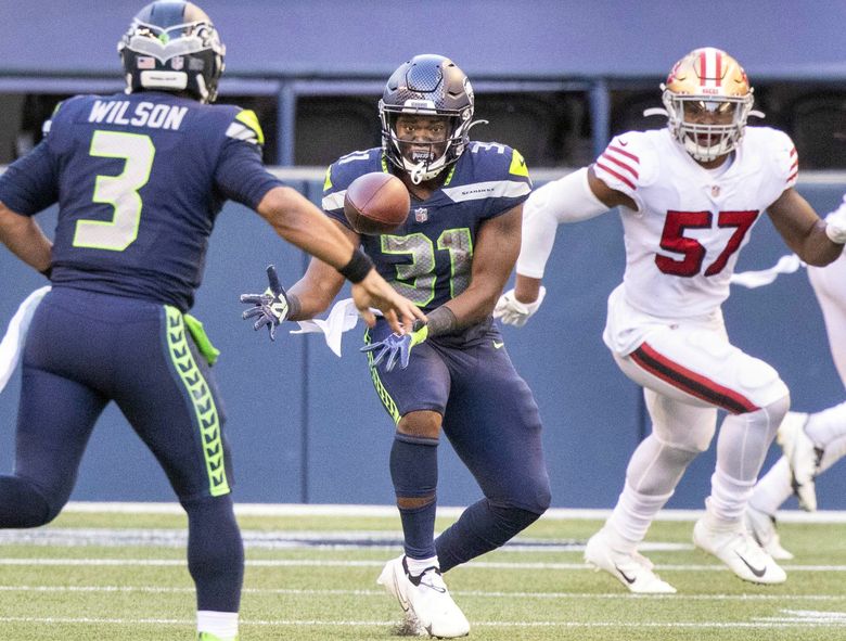 Seattle Seahawks running back DeeJay Dallas (31) during an NFL football game  against the Denver Broncos, Monday, Sept. 12, 2022, in Seattle, WA. The  Seahawks defeated the Bears 17-16. (AP Photo/Ben VanHouten