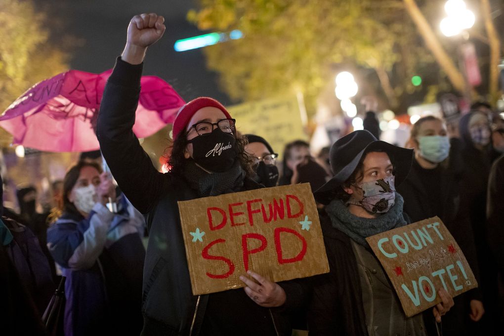 Torin Bracey participates in the “Count Every Vote – Protect Every Person” rally and march in Occidental Park on Wednesday. Bracey says he attended the event to support the Black Lives Matter movement and that he “won’t accept results that don’t directly reflect the will of the people.” (Erika Schultz / The Seattle Times)