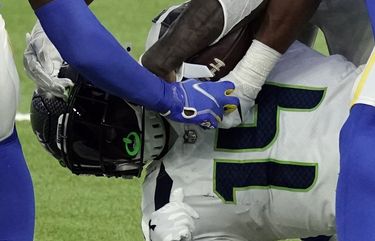 Seattle Seahawks wide receiver DK Metcalf (14) is tackled by a group of Los Angeles Rams defenders after a catch during the second half of an NFL football game Sunday, Nov. 15, 2020, in Inglewood, Calif. (AP Photo/Jae C. Hong) CAMS293 CAMS293
