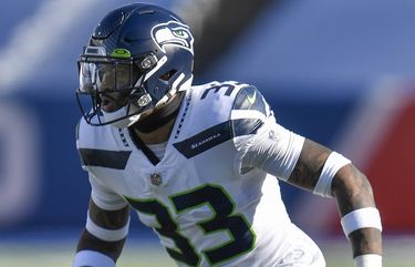 The stadium is reflected in the helmet visor of Seattle Seahawks' Jamal  Adams as he stands on the field before an NFL football game against the  Jacksonville Jaguars, Sunday, Oct. 31, 2021