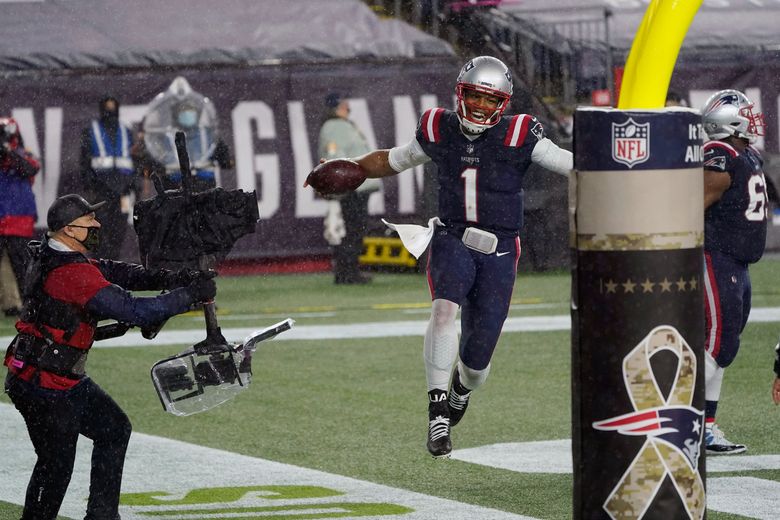 Cam Newton helps Patriots beat Ravens in rain and wind