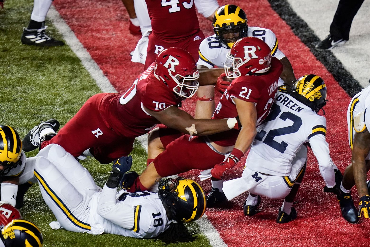 Michigan football safety Daxton Hill, running back Hassan Haskins