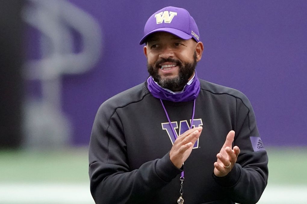 In this Friday, Oct. 16, 2020, file photo, Washington head coach Jimmy Lake watches his team during NCAA college football practice in Seattle. (AP Photo/Ted S. Warren, File)