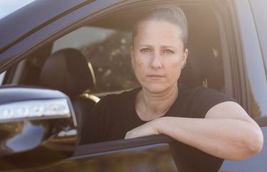 Tonje Ettevol, a driver for Uber and Lyft, sits inside her car in Carlsbad, Calif., on Nov. 27, 2020. MUST CREDIT: Bloomberg photo by Ariana Drehsler.