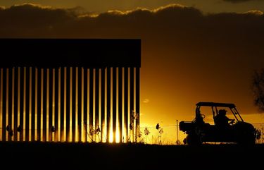 Authorities pass a border wall construction site, in Mission, Texas, Monday, Nov. 16, 2020. President-elect Joe Biden will face immediate pressure to fulfill his pledge to stop border wall construction. But he will confront a series of tough choices left behind by President Donald Trump, who’s ramped up construction in his final weeks. (AP Photo/Eric Gay) PNA710 PNA710
