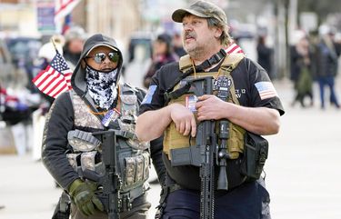 President Trump supporters carry rifles during a rally at the Capitol building in Lansing, Mich., Saturday, Nov. 14, 2020. (AP Photo/Paul Sancya) MIPS117
