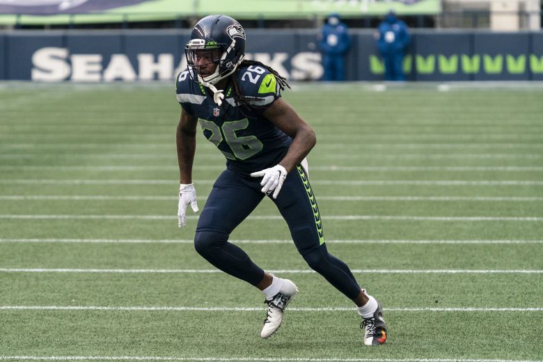 Los Angeles, CA, USA. 11th Nov, 2018. Seattle Seahawks outside linebacker  Shaquem Griffin (49) and Seattle Seahawks cornerback Shaquill Griffin (26)  show off their grills during the NFL Seattle Seahawks vs Los