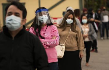 People wait in line for COVID-19 testing at a testing site operated by CORE in Los Angeles, Monday, Dec. 7, 2020. The vast region of Southern California went into a lockdown Monday in an effort to curb spiraling coronavirus infections and hospitalizations. (AP Photo/Jae C. Hong) CAJH110 CAJH110