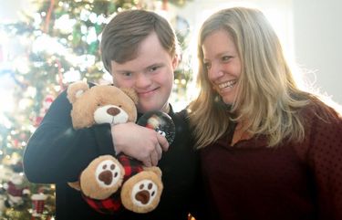 Ben Carnes and his mother, Julie Carnes, at their home on Dec. 3, 2020, in Crystal Lake. Friends and neighbors put on a Christmas parade for Ben, who loves parades, outside the Carnes family home last Sunday because the annual Crystal Lake Christmas parade was canceled due to the COVID-19 pandemic.