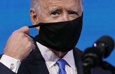 President-elect Joe Biden removes his mask as he arrives to speak after the Electoral College formally elected him as president, Monday, Dec. 14, 2020, at The Queen theater in Wilmington, Del. (AP Photo/Patrick Semansky) DEPS119 DEPS119