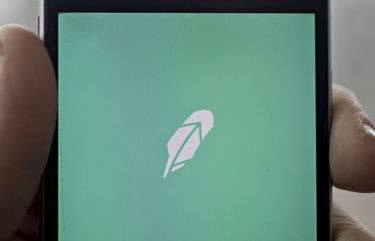 The Robinhood application is displayed on an Apple Inc. iPhone in an arranged photograph taken in Washington, D.C., U.S., on Friday, Dec. 14, 2018. The Securities Investor Protection Corp. said a new checking account from Robinhood Financial LLC raises red flags and that the deposited funds may not be eligible for protection. Photographer: Andrew Harrer/Bloomberg