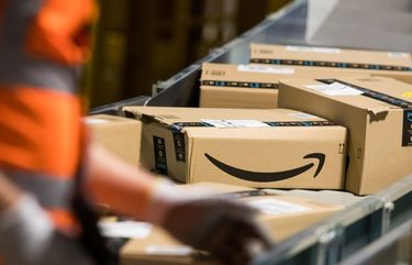 Packages sit on a conveyor belt at an Amazon.com Inc. fulfilment center in Kegworth, U.K., on Monday, Oct. 12, 2020. Prime Day, a two-day shopping event Amazon unveiled in 2015 to boost sales during the summer lull, usually occurs in July, but this year got pushed to Oct. 13 in 19 countries, including Brazil, with over 1 million products for sale worldwide. Photographer: Chris Ratcliffe/Bloomberg 775575582