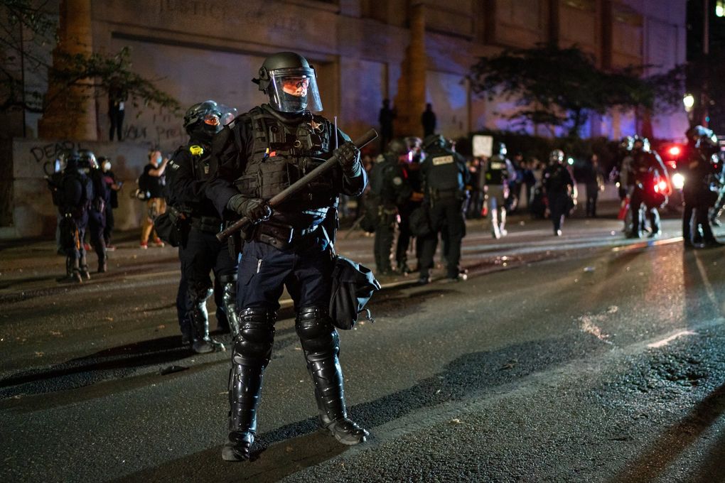 Police in riot gear at a Black Lives Matter demonstration in Portland, Ore., Sept. 26, 2020, during the months of protests following the death of George Floyd. The Portland police have been accused of using excessive force during protests this year. (Diana Zeyneb Alhindawi / The New York Times)