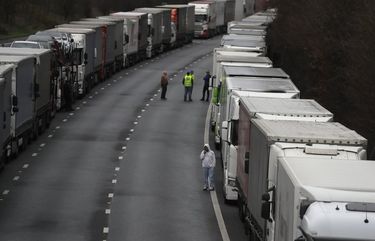 Trucks are parked on the M20 motorway as part of Operation Stack, whilst the Port of Dover remains closed, in southern England, Tuesday, Dec. 22, 2020. Trucks waiting to get out of Britain backed up for miles and people were left stranded as dozens of countries around the world slapped tough travel restrictions on the U.K. because of a new and seemingly more contagious strain of the coronavirus in England.(AP Photo/Kirsty Wigglesworth) LKW127 LKW127