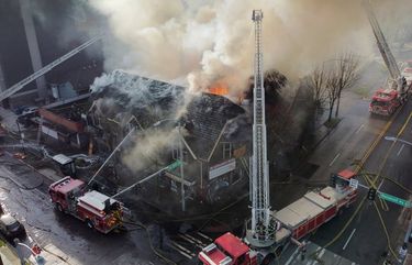 Fire fighters battle flames as the old shuttered Seven Gables Theatre burns, Thursday, Dec. 24, 2020 in Seattle’s University District. 