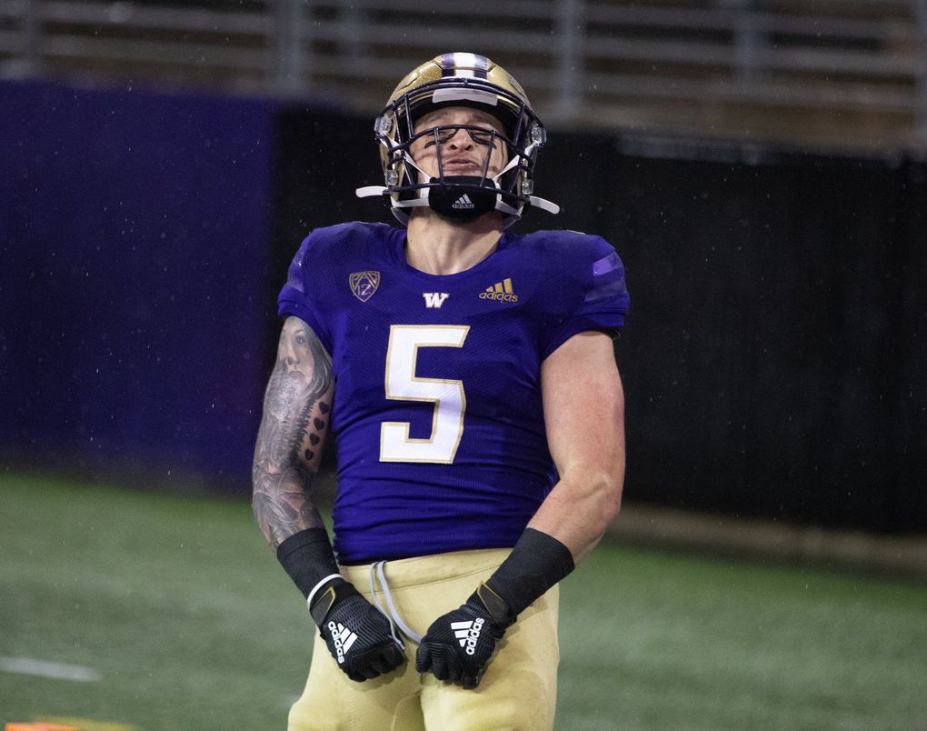 Washington Huskies running back Sean McGrew (5) celebrates his first quarter touchdown as the Washington Huskies play the Oregon State Beavers at Husky Stadium in Seattle on November 14, 2020. 215611 (Mike Siegel / The Seattle Times)