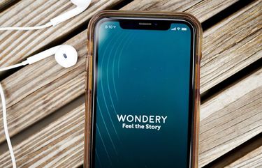 The logo for Wondery is displayed on a smartphone in an arranged photograph taken in the Brooklyn borough of New York, U.S., on Tuesday, Sept. 29, 2020. Wondery Inc. is expected to garner at least $200 million if it pursues a sale and could fetch as much as double that, which would represent the biggest podcasting transaction to date, according to people familiar with the matter. Photographer: Gabby Jones/Bloomberg