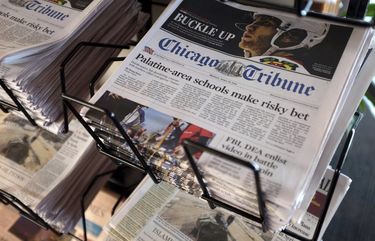 FILE – In this Monday, April 25, 2016, file photo, Chicago Tribune and other newspapers are displayed at Chicago’s O’Hare International Airport.  Hedge fund Alden, Tribuneâ€™s largest shareholder, has offered to buy the rest of the newspaper publisher, Thursday, Dec. 31, 2020,  at a price that values it at $520.6 million.   (AP Photo/Kiichiro Sato, File) NYBZ406 NYBZ406