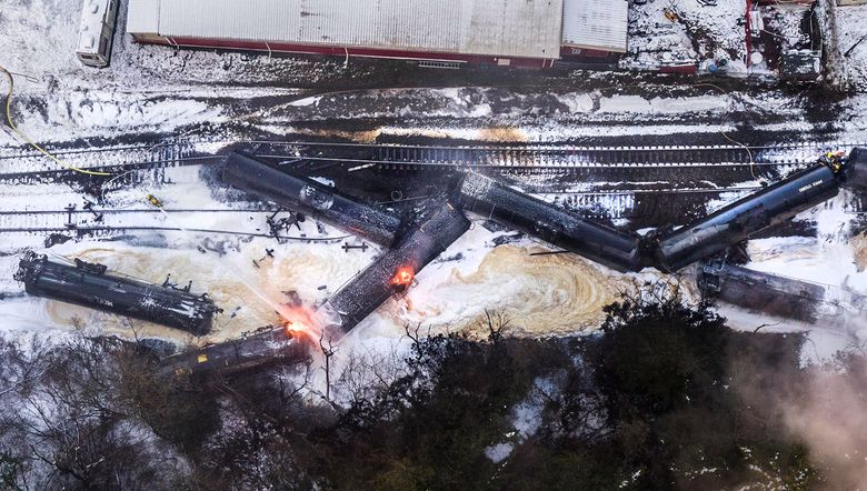 In this aerial view from a drone, a train carrying crude oil burns while derailed on December 22, 2020 in Custer, Washington. BNSF Railway Company released a statement saying the train was traveling north when seven tank cars derailed, resulting in a fire and evacuations of the area.  (David Ryder / Getty Images)