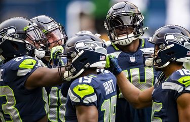 Wide receivers huddle before the Seattle Seahawks take on the New York Jets at Lumen Field in Seattle Sunday December 13, 2020. Clockwise from left, David Moore, Freddie Swain, DK Metcalf, Tyler Lockett and Penny Hart. 215892