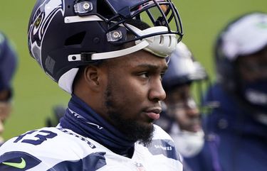 Seattle Seahawks' Carlos Dunlap on Russell Wilson: 'He told me he's with us  and he's here to stay' 