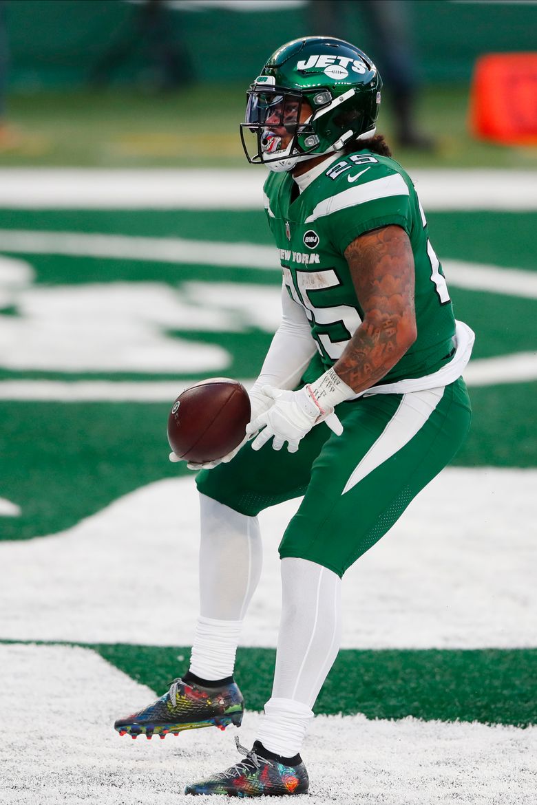 New York Jets running back Ty Johnson (25) looks on against the