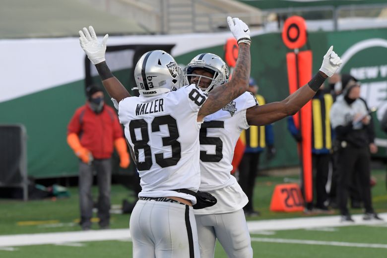 FILE - Las Vegas Raiders tight end Darren Waller looks on before