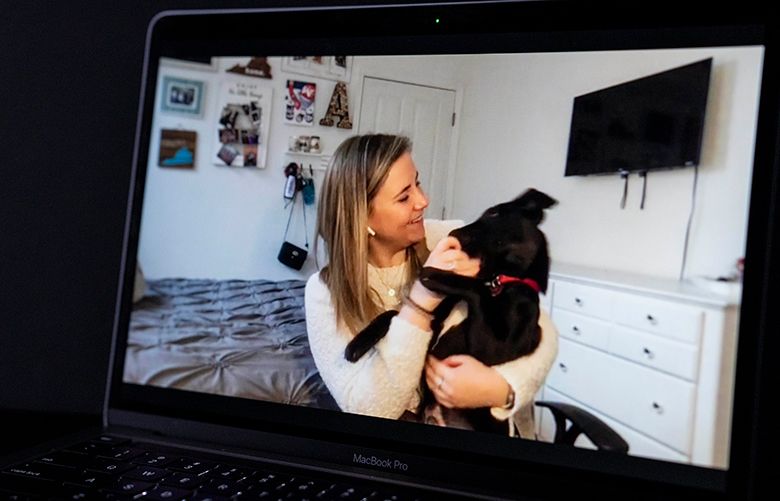 Allie Micka, shown at home in Washington, D.C., joined a tech firm she admired for its highly social culture, but now her work is virtual and her contact with co-workers is strictly transactional. (Carolyn Van Houten / The Washington Post)